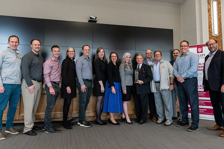 Entrepreneurship faculty team receiving award presented by Julienne Shields, president and CEO of USASBE.