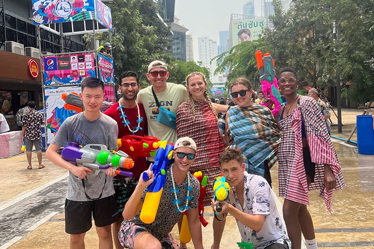 A group of students in the 3/2 MBA accounting field study program in Thailand attend the Songkran Festival.