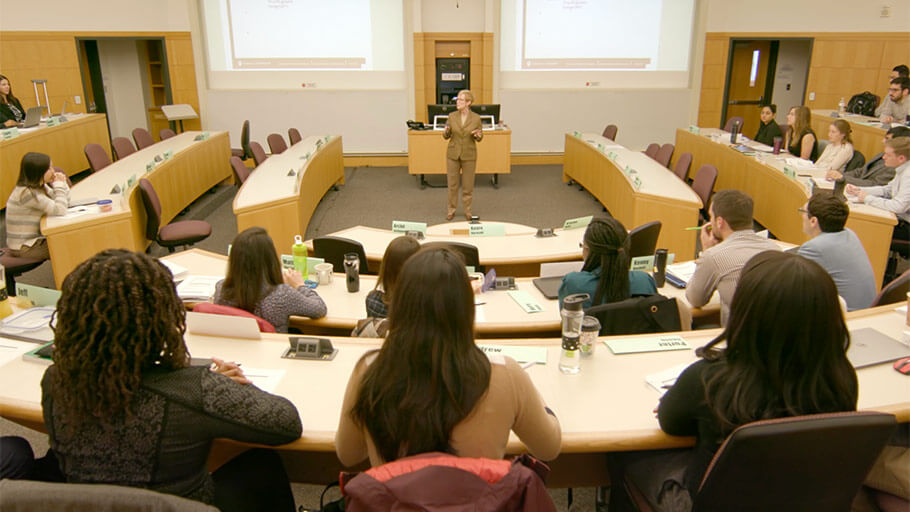 students listening to a speaker in a cohort