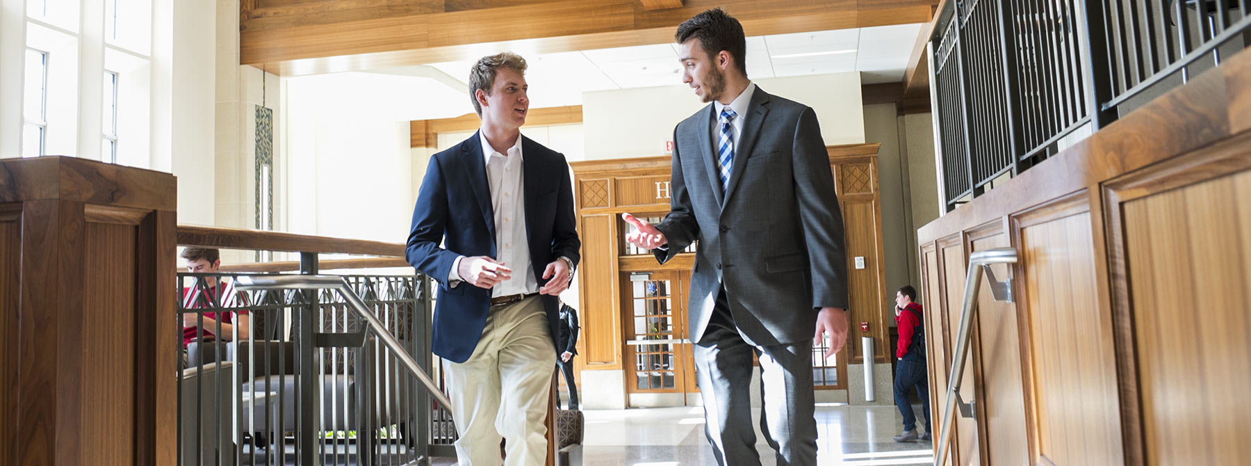 Two students walking up the stairs in Hodge Hall at the Kelley School of Business.