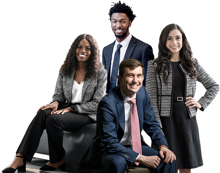 Four Kelley students from diverse backgrounds model business professional attire for men and women, including coordinated blouses, shirts, and suits in black, navy, and white.